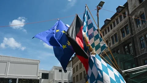 Munich, Bavaria, Germany: Flags of Germany, Bavaria and the European Union. Stock Footage 308630419