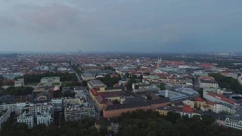 Munich in the evening flight on a city with a view on the roofs of houses and Stock Footage 95586155