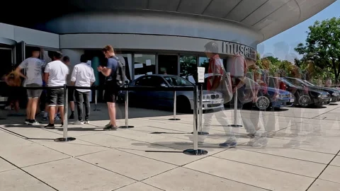 Munich, Germany - 12/04/2023: Time-lapse of visitors queuing at the BMW Stock Footage 260809265