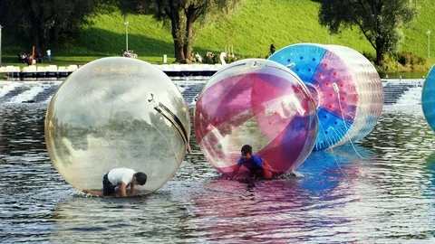 Munich, Germany - AUGUST 20, 2017: A floating water ball at a summer festival Stock Footage 95429355