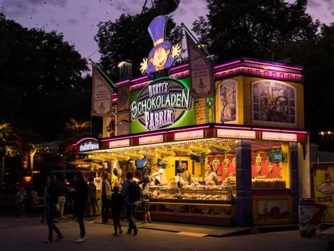 MUNICH, GERMANY - AUGUST 20, 2017: A large sweet shop in the eve Stock Photos