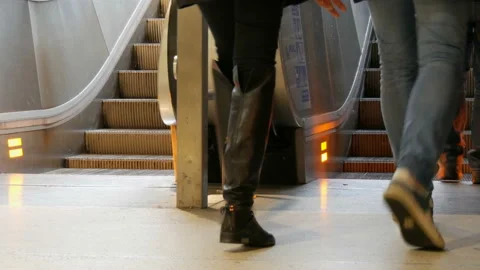 Munich, Germany - December 2, 2018: People climb on the steps of escalator. Stock Footage 101122537