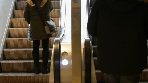 Munich, Germany - December 2, 2018: People climb on the steps of escalator. Stock Footage 101129586
