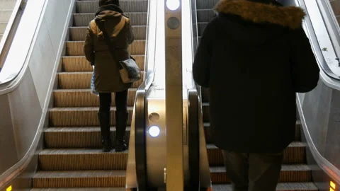 Munich, Germany - December 2, 2018: People climb on the steps of escalator. Stock Footage 101131779