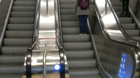 Munich, Germany - December 2, 2018: Large modern staircase escalator rides in Stock Footage 119891495