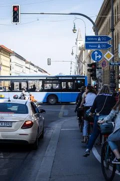 MUNICH, GERMANY - Jun 12, 2021: Taxi and cyclists waiting for the traffic lig Foto stock