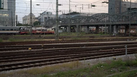 MUNICH, GERMANY - JUNE 25, 2018: Pan shot of grey train moving under hacker Stock-Footage 129758161