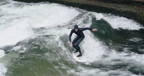 Munich, Germany - October 20, 2018: River surfing - zoom in on male surfer Video stock 99607338