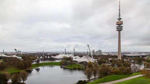 Munich Olympic Park Timelapse with Tower, Lake, and Cloudy Sky Stock Footage 240353285