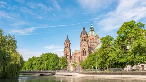 Munich skyline timelapse at St. Lukas Church Isar River, Germany 4K Time lapse Stock Footage 82848541