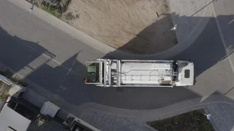 Municipal garbage truck at work, loading green trash cans. Stock Footage 167687763