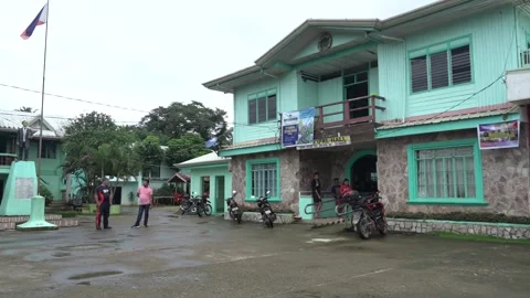 Municipal hall with mountain in the background in Samar Stock Footage 229647951
