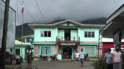 Municipal hall with mountain in the background in Samar Stock Footage 229648345