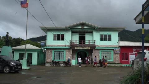 Municipal hall with mountain in the background in Samar Stock Footage 229648435