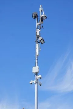 Municipal security tower with multi camera surveillance and LED floodlights Stockfoto's