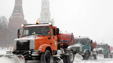 Municipal units with plows remove snowfall near Kremlin Stock Footage 4102468