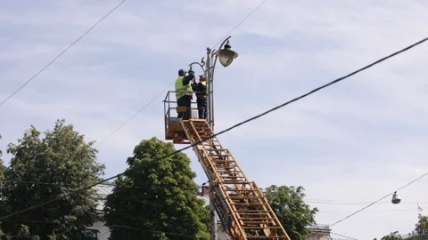 Municipal worker, led lights, replace light bulb, Stock Footage 274135220