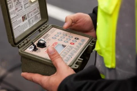 Municipal worker setting up computer traffic counter Stock Photos