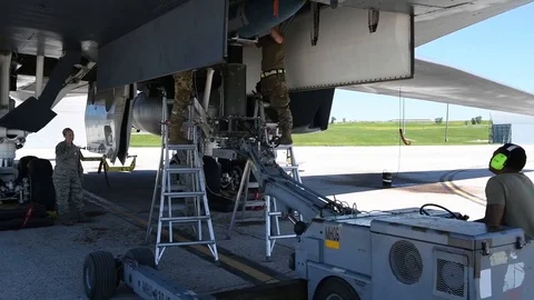 Munitions airmen loading bomb into B2 Lancer Stock Footage 112125019