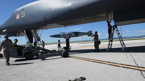 Munitions airmen positioning bomb for loading to B2 Lancer 動画素材 112125069