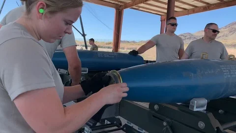 Munitions Systems Specialists building bombs at Nellis AFB Stock Footage 110213283