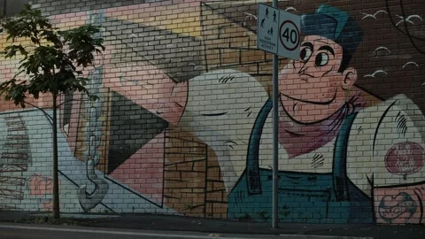 A mural depicting a dock worker in Sydney Australia 4K Stock Footage 267512018