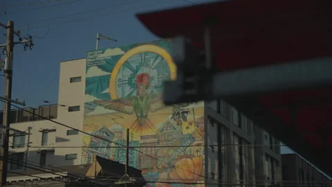 Mural painting on building with foreground element, San Francisco Stock Footage 333194115