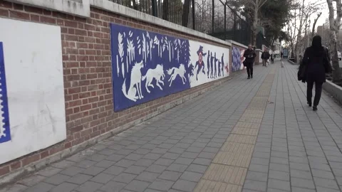 Mural in Tehran with image of eagle and elements of war Stock Footage 273102445