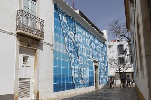 Mural with traditional azulejos tile pattern artist Add Fuel in the old town of Stock Illustration