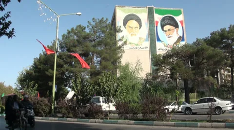 Murals of Iran's current and former Supreme Leader portrayed on building Stock Footage 33447655