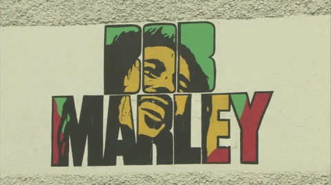 Murals on wall outside of Bob Marley Museum, 56 Hope Road, Kingston 스톡 동영상 50449764