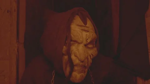 A murderer or an executioner in a terrible mask. A horror scene for Halloween or Stock Footage 238468546