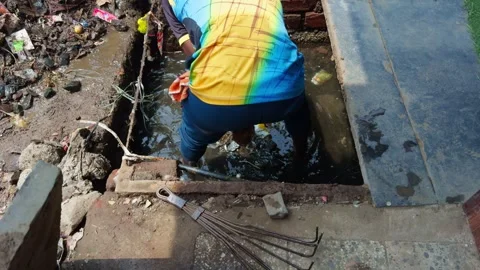 Murky Pit Surrounded by Garbage and Waste Stock Footage 313277754