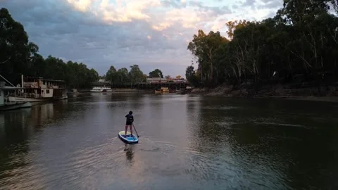 Murray River Sunset with Paddleboarder track to Echuca Stock Footage 245261910