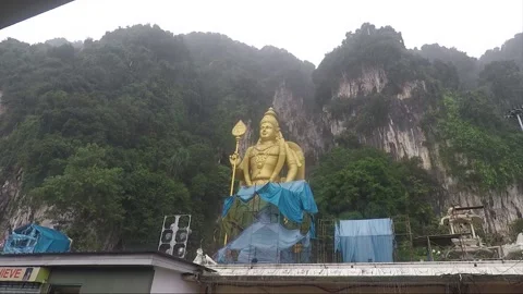 Murugan statue at Main Temple cave, Batu caves, Selangor, Kuala Lumpur, Malaysia Stock Footage 194431443