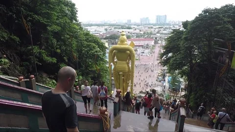 Murugan statue at staircase to Temple cave, Batu caves, Kuala Lumpur, Malaysia Stock Footage 194477254