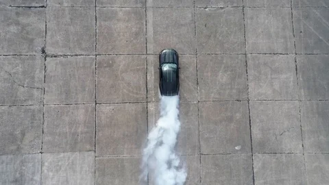 Muscle Car burnout - launching while burning tires - aerial view Video stock 89168503
