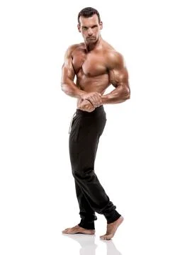 Muscle man posing in studio, isolated over a white background Stock Photos
