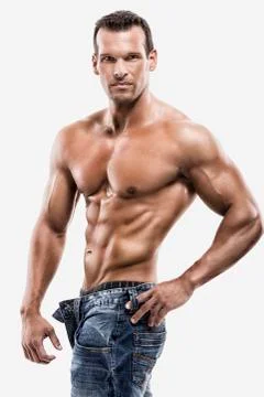 Muscle man posing in studio, isolated over a white background Stock Photos