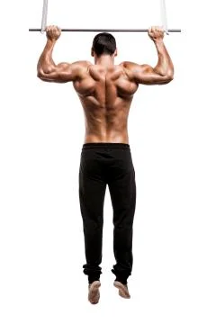 Muscle man in studio making elevations, isolated over a white background Stock Photos