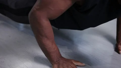 Muscular athlete does push ups, intense work out at home Stock Footage 133536716
