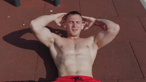 Muscular athlete doing abs exercise during outdoor training Stock Footage 244854558