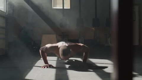 Muscular Athletic Man Does Pushups in a Gym Stock Footage 208743078