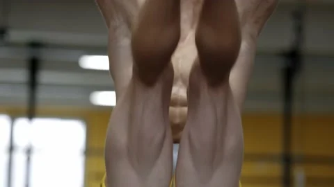 Muscular athletic man doing abs crunches in the gym. Abdominal muscles workout Video stock 169599563