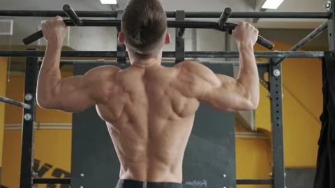 Muscular athletic man workout back muscles in the gym doing pull ups Stock Footage 170500738