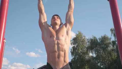 Muscular athletic young man doing pull up on the horizontal bar. Sport and he Stock-Footage 159471498