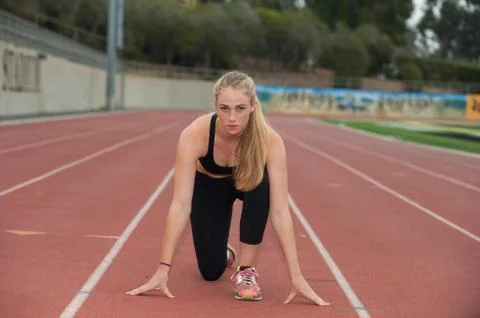 Muscular blond runner ready to start Stock Photos