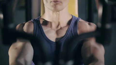 Muscular bodybuilder doing exercises workout in gym for pectoral muscles Stock Footage 52091157
