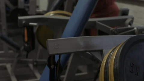 Muscular bodybuilder guy doing exercises in gym.Man working with weights in gym Stock Footage 70076444