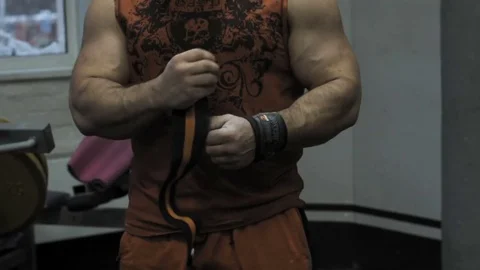 Muscular bodybuilder guy doing exercises in gym.Man working with weights in gym Stock Footage 70076463